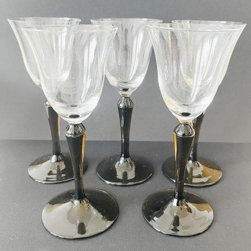 Vintage set of five Kristalunie Maastricht Campanula liqueur glasses with black iridescent base from the 1930s, designed...