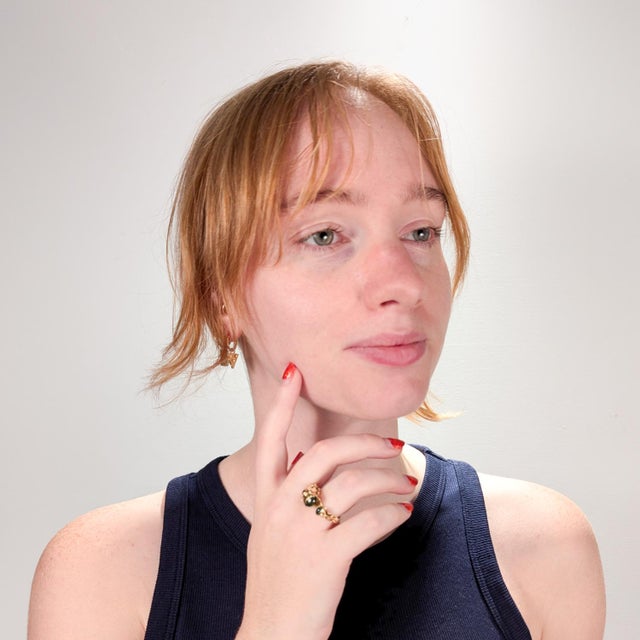 A fine bench made ring. In 18 karat yellow gold. Comprised of spun & textured layers of gold. In the form of 2 stylized...