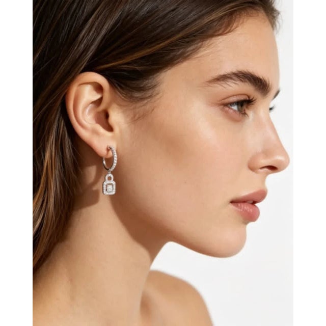 This gorgeous pair of 14K white gold earrings features: Diamonds: Numerous brilliant round diamonds totaling 1.5 carats...
