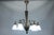 French Art Deco bronze chandelier with frosted geometric glass shades, circa 1930. Elegant six-light chandelier featuring...