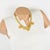 This elegant Louis Feraud Paris choker necklace features a romantic chain-necklace shape and gilded, ornate, iconic brand-...