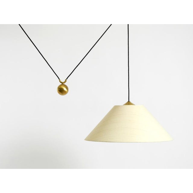 Large, original 1980s florian schulz pendant lamp model kera featuring a counterweight mechanism for continuously variable...