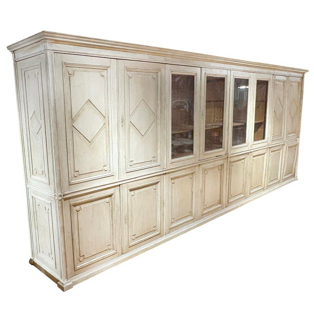 A stately set of Georgian-style pine cabinets crafted circa 1920, originally removed from a large home in Holland. These...
