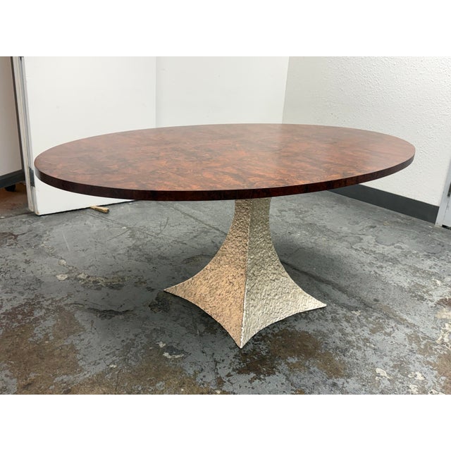 Design Plus Gallery presents the Noor Oval Dining Table from Made Goods. The oval top is wrapped in highly figured dark...