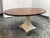 Design Plus Gallery presents the Noor Oval Dining Table from Made Goods. The oval top is wrapped in highly figured dark...
