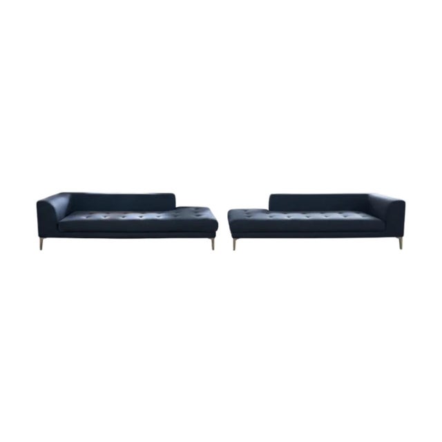 This contemporary Roche Bobois sofa is upholstered in slate blue polished wool, a fabric with a soft sheen and a smooth...
