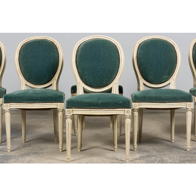 This elegant set of eight antique French dining chairs is executed in the Louis XVI style and dates to the early 20th...