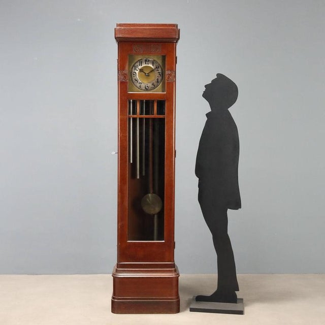 Art Nouveau mahogany pendulum clock, crafted in Italy at the beginning of the 20th century. The front door features glass...
