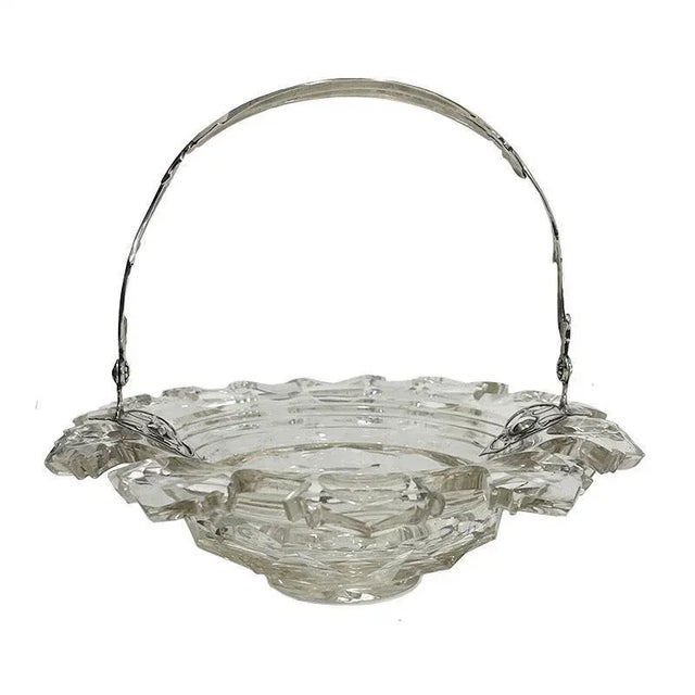 A Dutch crystal bowl with silver swing handle, 1875 A beautiful 19th century Dutch crystal bowl with scalloped edges with...