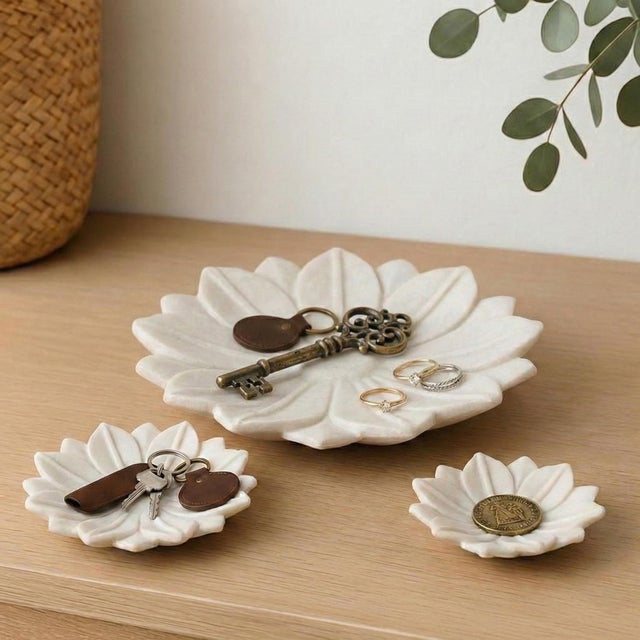 Elevate your home sanctuary with the serene beauty of our Hand Carved Stone White Marble Lotus Catchall Dish Set of 3....