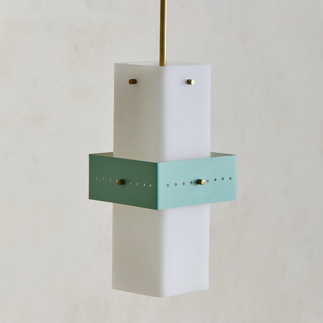 A 1950s Italian pendant light in the manner of Stilnovo, defined by a minimal, architectural silhouette. A rectangular...