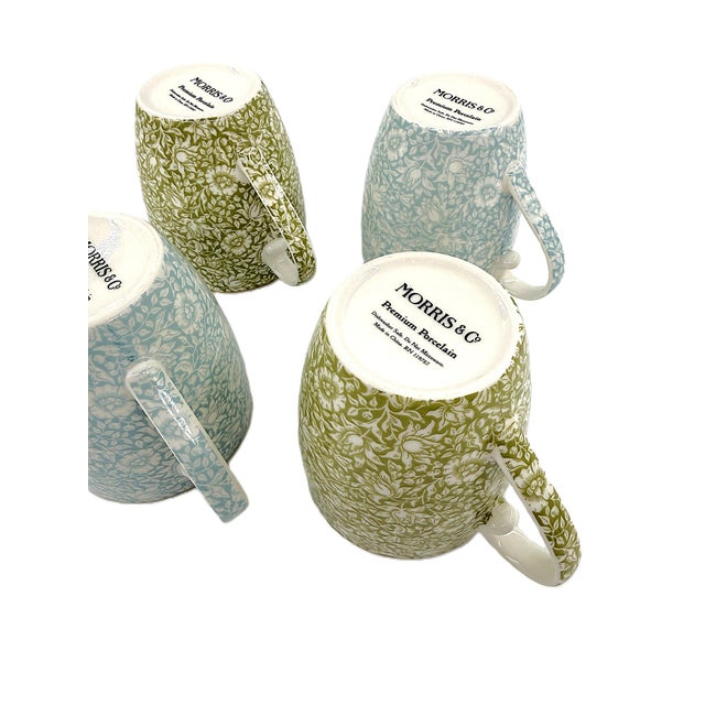 Bring timeless English design into your daily coffee or tea ritual with this set of four porcelain mugs inspired by the...