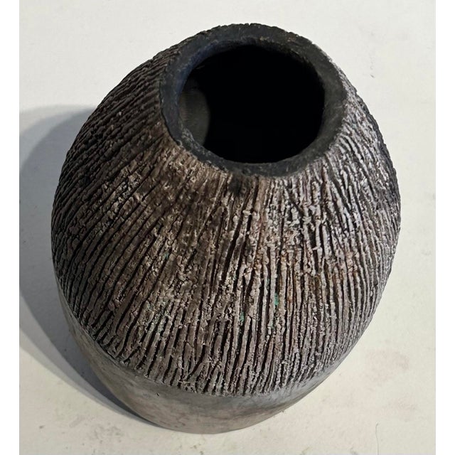 Oval vase with ribbed texture