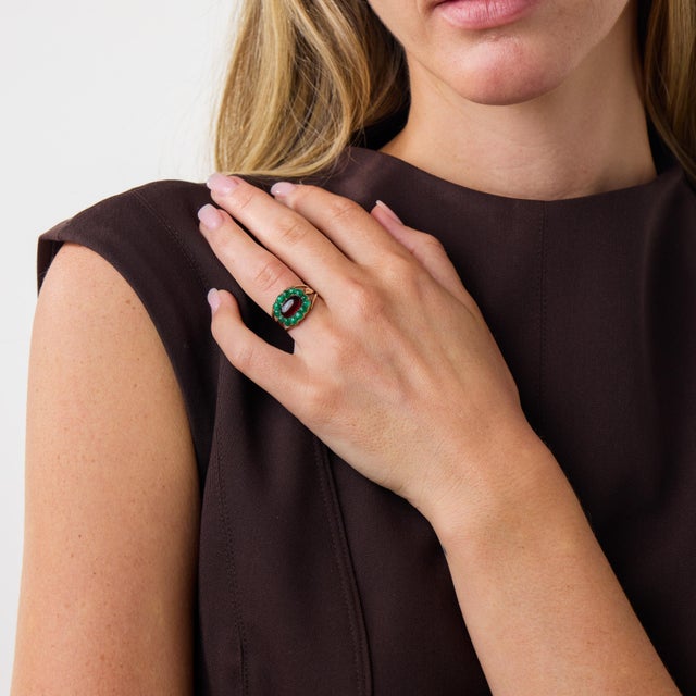 This distinctive Georgian ring is a beautifully colorful jewel from the 1860’s, centered by a smooth cabochon cut garnet....