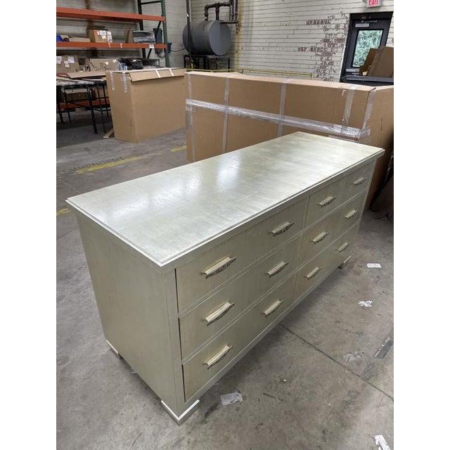 The Voyager Chest, with its antique silver leaf finish and light distressing, offers timeless elegance and vintage charm.