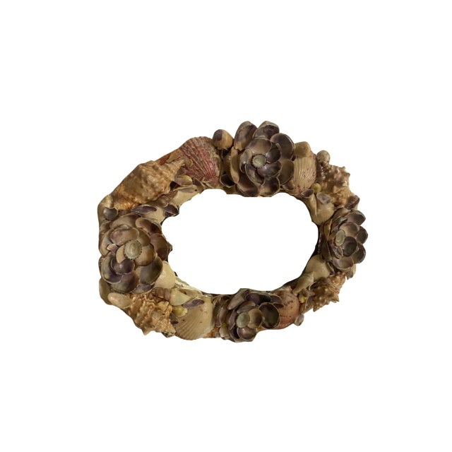 Vintage Sea Shell Wall Mirror, Circa 1960’s. Shells arranged In a oval shape and the mirror can be hung vertically or...