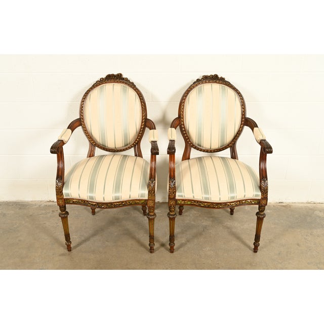 A gorgeous pair of French Regency Louis XVI style armchairs or dining captain chairs In the manner of Karges Furniture...