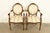 A gorgeous pair of French Regency Louis XVI style armchairs or dining captain chairs In the manner of Karges Furniture...