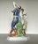 A beautifully hand-painted porcelain figurine by Herend, depicting a romantic pair of Hungarian folk dancers in mid-...