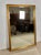 Elegant large Spanish wall mirror featuring a finely crafted giltwood frame with carved decorative mouldings and a warm...
