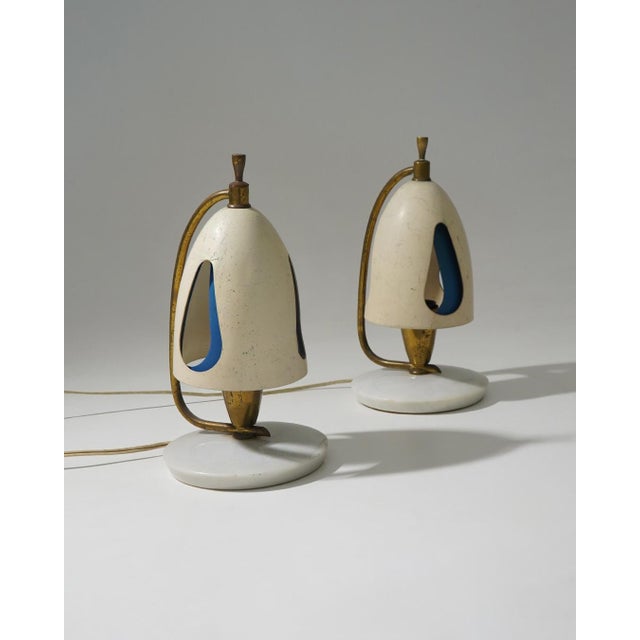 A rare and refined example of 1950s Italian lighting, this pair of table lamps designed by Angelo Lelii for Arredoluce...