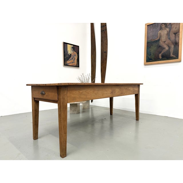 The timeless elegance of walnut for your dining room. This superb antique table is distinguished by the nobility of its...