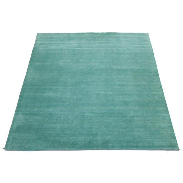 Discover our stunning handcrafted Gabbeh-style wool rug, showcasing a rich Deep Teal design. Proudly part of our Desert...