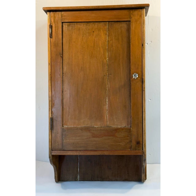 Nice primitive pine wall cabinet with shelves