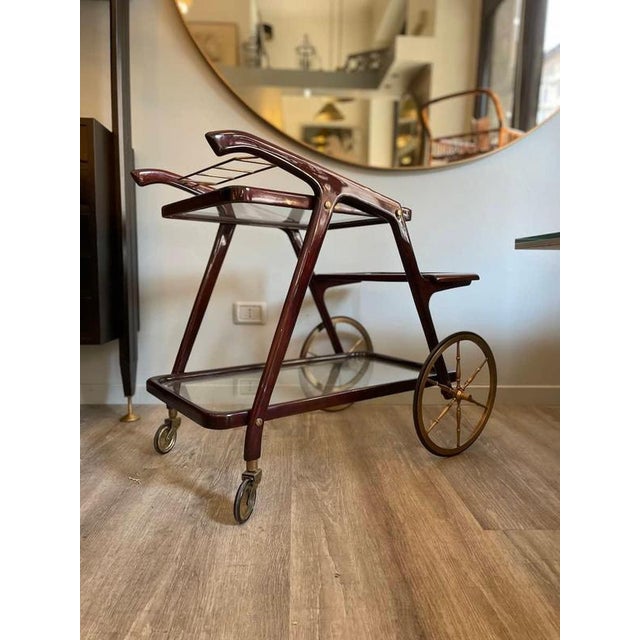 1960s wooden trolley with removable tray years. The wheels are original of the period, as is the glass. The trolley has...