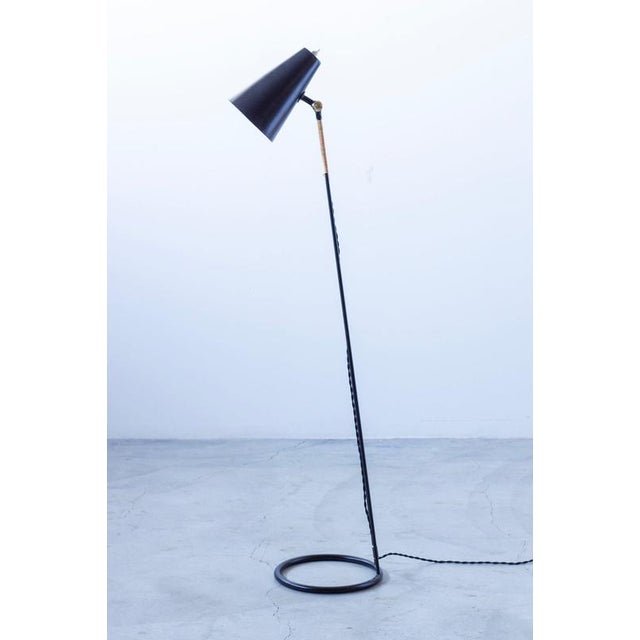 Floor lamp designed by eje ahlgren. Produced in sweden by luco during the 1950s. Made from black lacquered steel with...