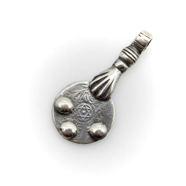 Purchased on a recent trip to Morocco, this vintage sterling silver Berber pendant consists of a hand holding a Hassan I 2...