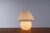 Quite big ( 27 cm ) mushroom shaped table or bedside lamp. Made of swirled glass, glossy surface, white. You can feel the...