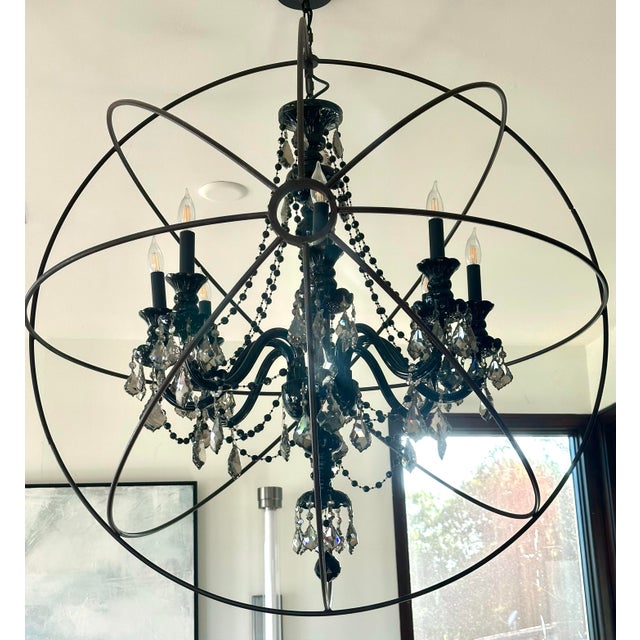 An exceptional statement lighting fixture featuring a genuine 48-inch Restoration Hardware metal orb, designed by Timothy...