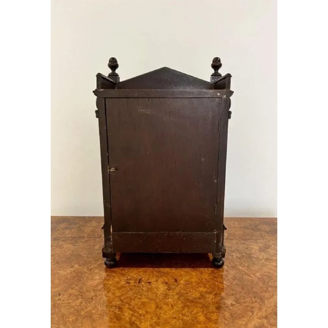 Antique Victorian quality ebonies aesthetic movement mantle clock having a quality painted dial and spandrels decorated...