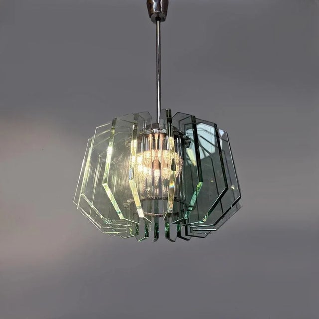 Italian mid-century modern chandelier by Max Ingrand for Fontana Arte, 1960s Glass chandelier with a round base. The...