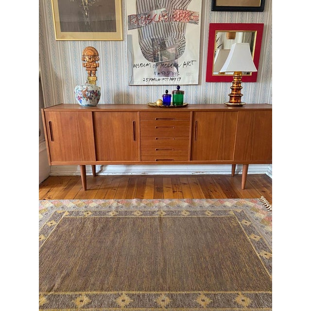 Scandinavian modern röllakan flatweave rug by a Swedish textile artist in the 1950s. This handmade wool rug on a linen...