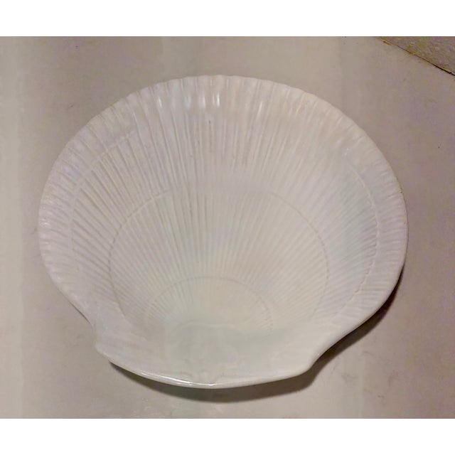 This vintage shell shaped dish has a white pearlescent glaze which reflects light with a luster like a real sea shell....