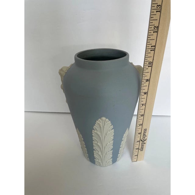 Elevate your collection with this exquisite Ecanada Jasperware blue vase, featuring a classic lion motif that captures...