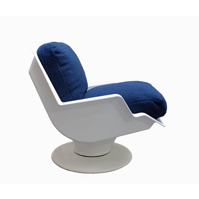 Mod. Nike swivel armchair designed by Richard Naegle for Sormani in the 1960s, with white painted metal outer frame. The...