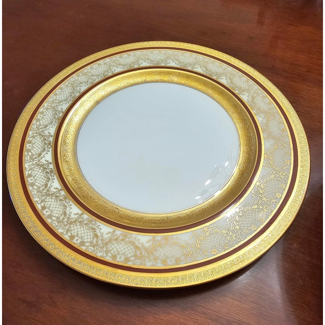 An exceptional set of 11 Heinrich Selb porcelain and gold encrusted dinner plates in white body in good antique...