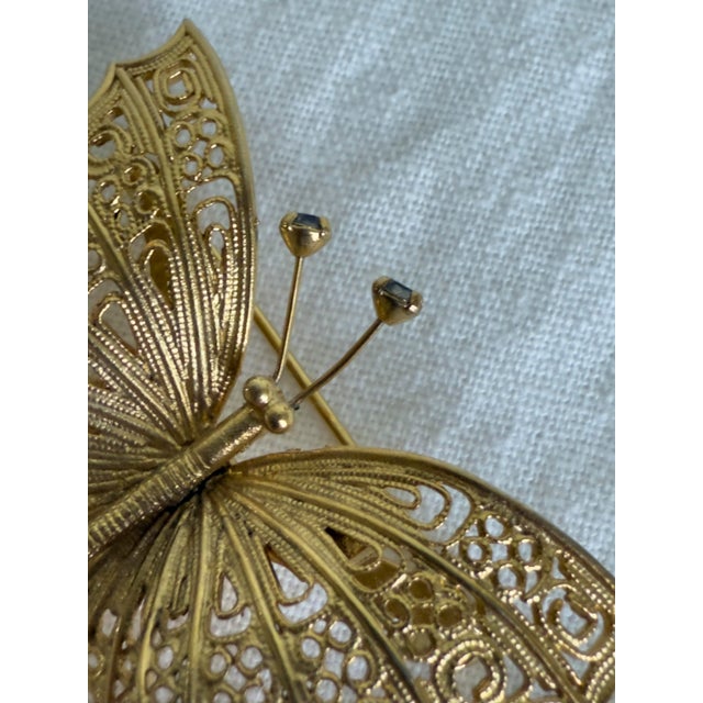 1960s Vintage 1960s Art Nouveau Revival Gold Tone Filigree Butterfly Brooch With Blue Rhinestone Accents For Sale - Image 5 of 7