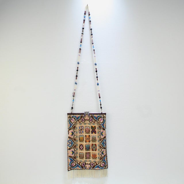 A very fine antique beaded bag. With micro beading and a exuberant variant of a tapestry or carpet pattern. Both sides are...