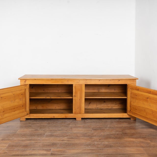 This Swedish pine sideboard is just over 7' long and maintains its simple country charm with a waxed finish on the natural...