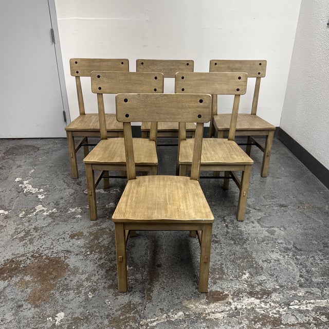 Design Plus Gallery presents a Set of Six Benchwright Dining Chairs from Pottery Barn. The chairs are constructed from...