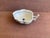 Delicate leaf form gently scalloped rim and a branch stalk handle; great as a nut or pickle dish.