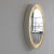 A large illuminated mirror with 8 light sockets hidden behind the mirror glass. Painted and curved wood in light grey with...