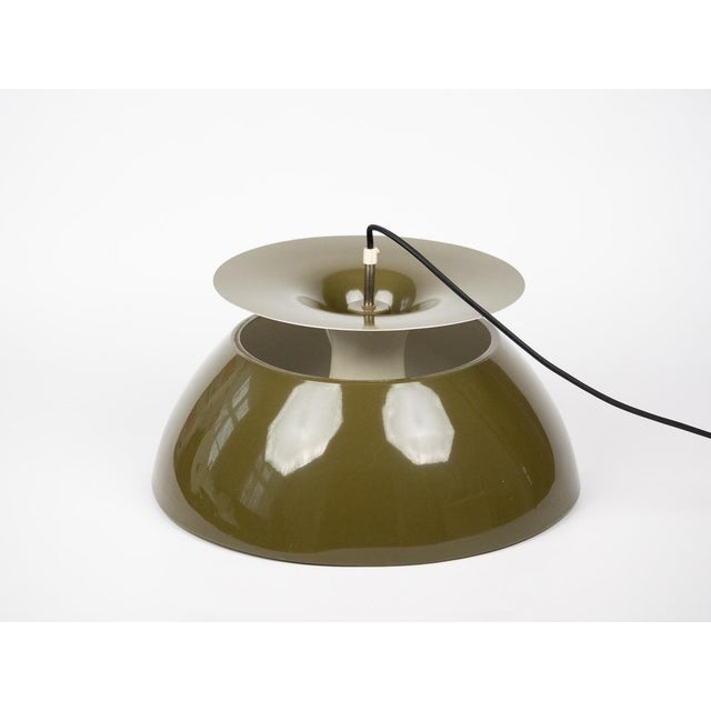 The Jutlandia lamp was designed by Danish designer Jørgen Høj for Holmegaard in the 1970s. Made of lacquered metal, it...