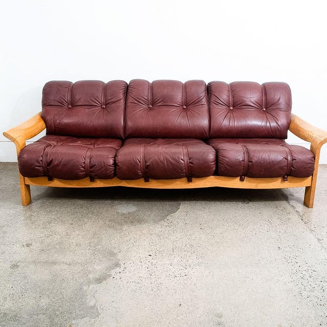 Danish Modern 3 seater sofa in Oxblood red leather. Ultra comfortable and ready for your home or space. The design allows...