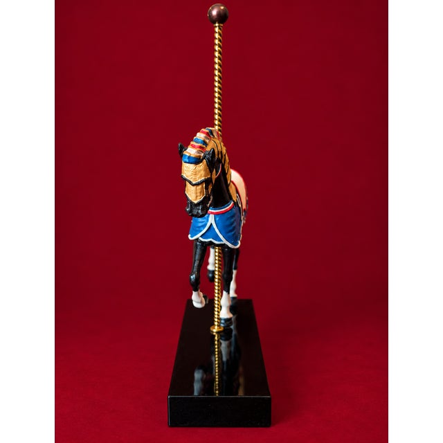 Celebrate the nostalgic charm of the American carousel with this beautifully detailed vintage "The Patriotic Horse"...