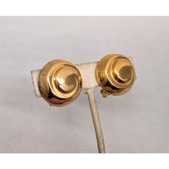 1980s goldtone round domed swirl clip earrings. Marked "LANVIN PARIS" on cartouches on the backs. Measure: 1 inch across...